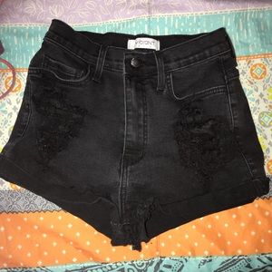 high rise black ripped jean shorts.
